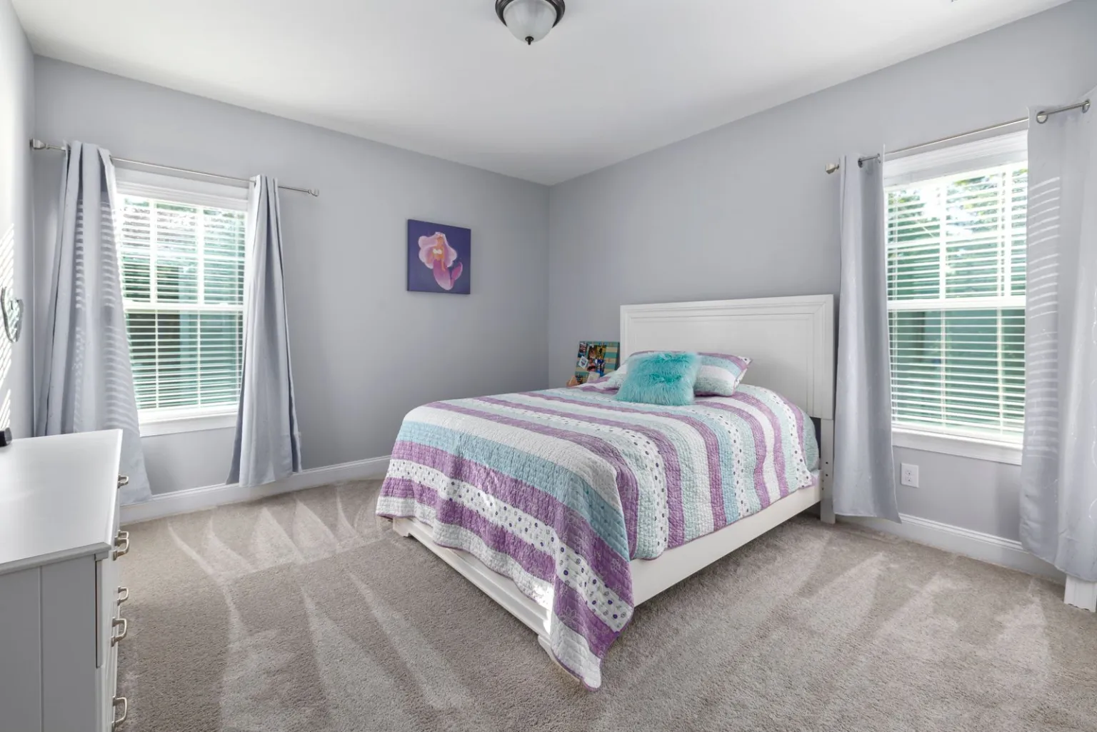 Bedroom with light carpet